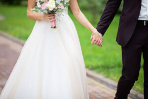 bride groom holding hands