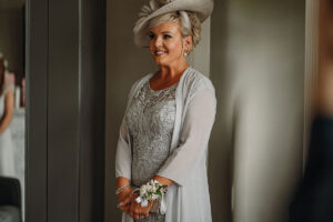 a smiling lady wearing an outfit from Patricia Forbes