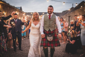 a bride and groom sparkler shot at Cow Shed Crail