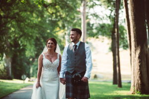 bride and groom walking holding hands Richard Campbell Photography