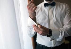 Man getting dressed for a wedding