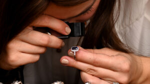 Customer looking at bezel set sapphire rings