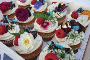 Flower and fruit decorated cupcakes by Northern Lights Cakery