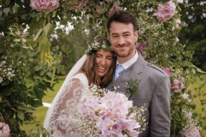a bride and groom in garden at Raemoir House