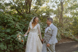 bride and groom walking hand in hand